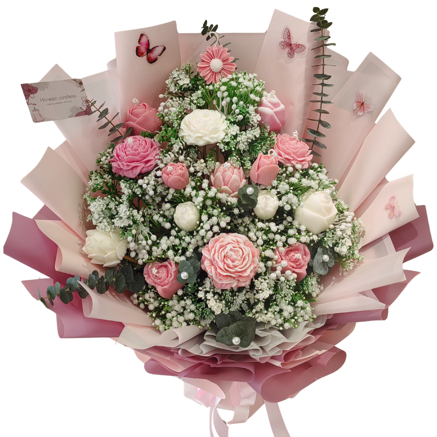 Blushing Elegance is a bouquet mix of pink and white flower candles and white artificial filler flowers, with fresh eucalyptus leaves topped with pearl buttons. Fancy wrapped in pink floral paper and light pink satin ribbon.