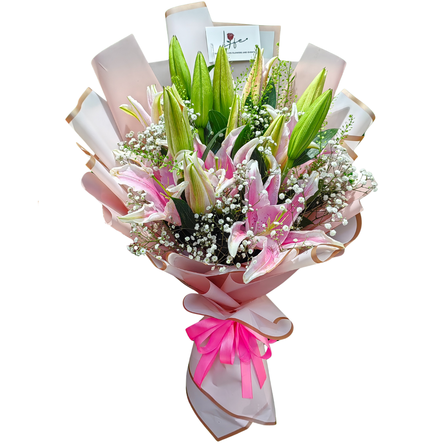 Fresh bouquet of pink stargazer lilies and white gypsophila wrapped in blush pink and gold cellophane with bright pink ribbon-– floral gift by Hayat Flowers Dubai.