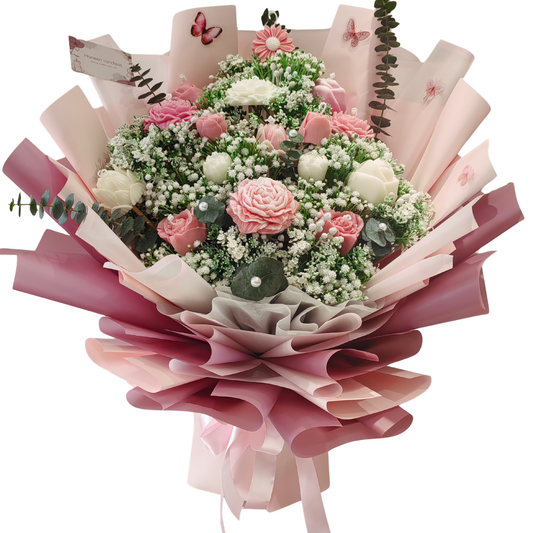 Bouquet mix of flower candles and artificial filler flowers, with fresh eucalyptus leaves. Fancy wrapped in pink floral paper and light pink satin ribbon.