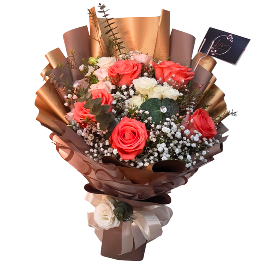 Elegant bouquet of peach and white roses with white gypsophila, wax flowers, and eucalyptus wrapped in luxurious floral paper.