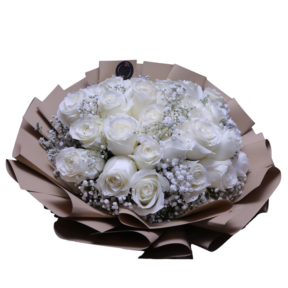 Side view of a hand-tied Pure White Elegance bouquet featuring 25 white roses and gypsophila with simple, kraft paper wrapping.