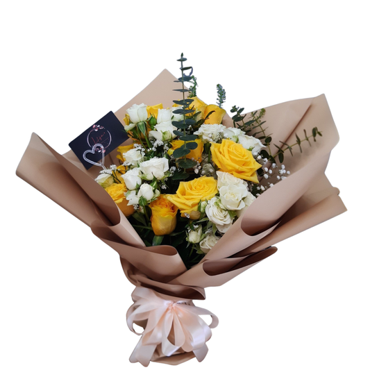 Hand-tied bouquet of 10 bright yellow roses with white spray roses, gypsophila, and eucalyptus foliage, wrapped in Kraft paper and pale peach ribbon.