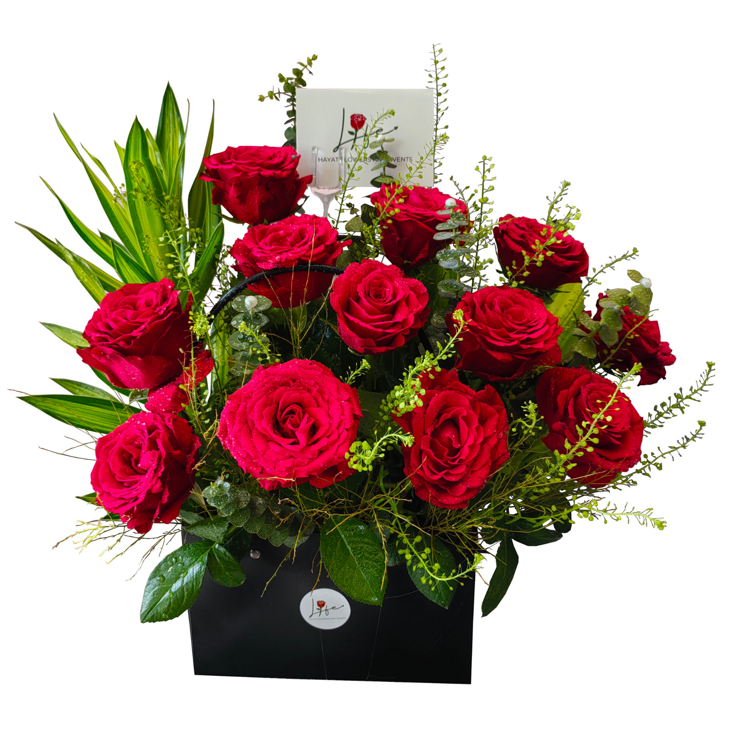 Classic Red Rose Elegance - 12 long-red roses arranged with solidago, lipidium, jamaica leaves, and eucalyptus in a chic black paper bag.
