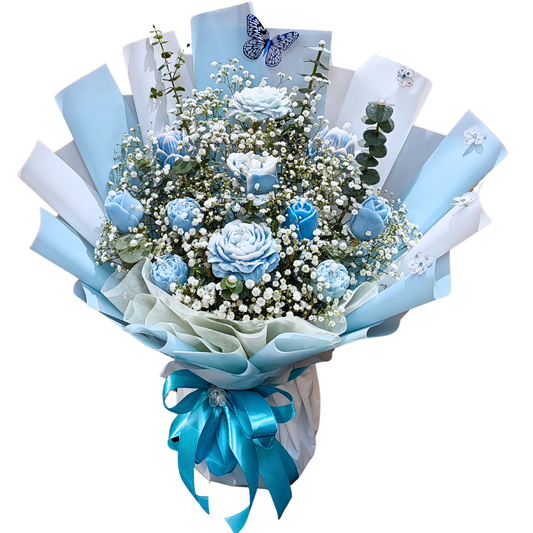 Hayat Flower's 'Dreamy Blue' Candle Bouquet is comprised of blue wax flower candles with delicate white gypsophila and sprigs of eucalyptus cinerea. A dreamy sight in the summer weather.