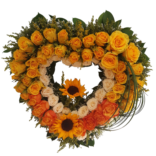 Heart-shaped floral wreath with yellow, orange, and white flowers, ruscus greenery, and grass accents.