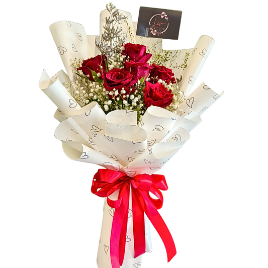 Love Struck bouquet-- 6 red roses, white gypsophila, lavender limoniums and green lipidiums arranged together in a romantic and elegant way, wrapped in white glossy paper with heart prints and red satin ribbon.