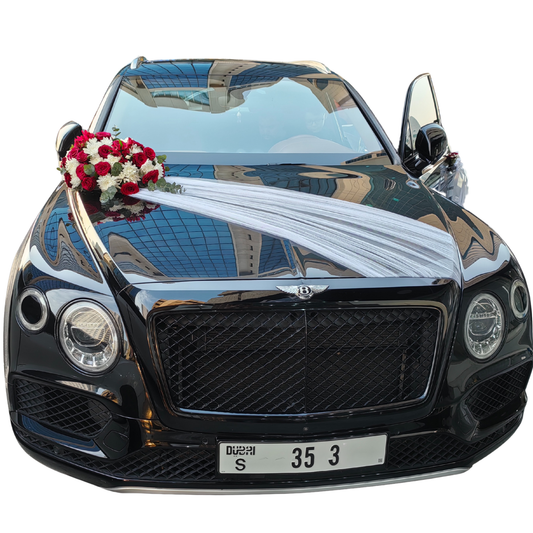 PASSION'S CASCADE floral arrangement and decorations on a Black Bentley SUV by Hayat Flowers and Events.