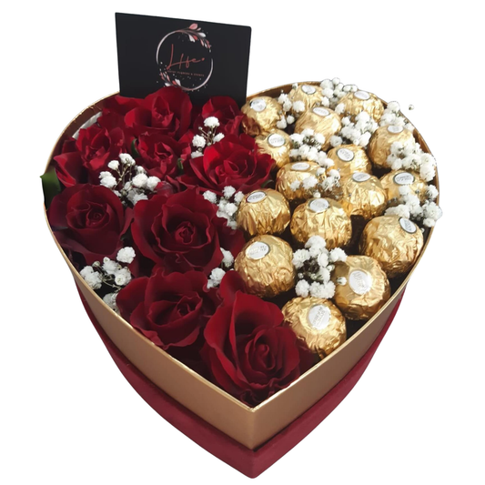 Heart-shaped red flower box featuring 10 fresh red roses and 15 Ferrero Rocher chocolates, styled for romantic gifting.