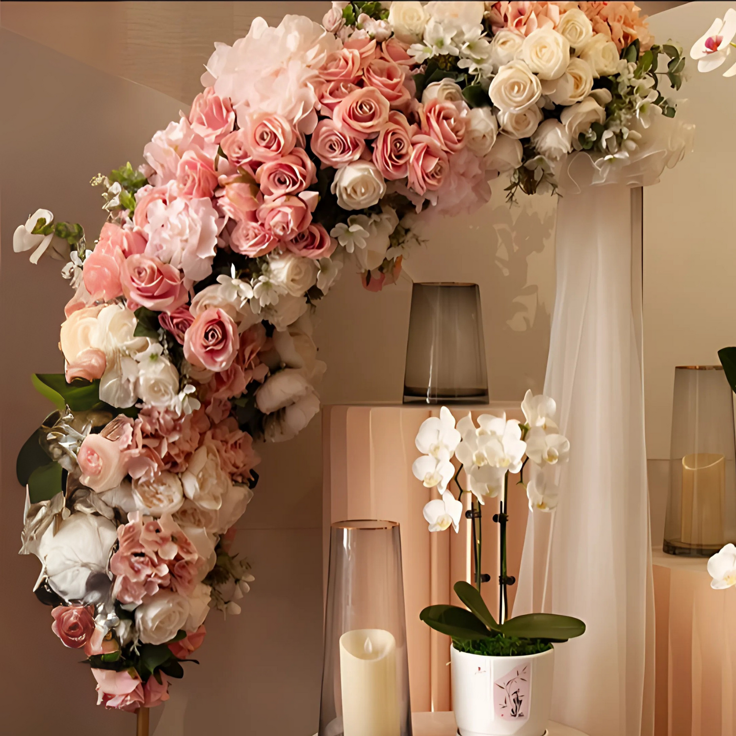 Luxury wedding arch in blush and ivory tones, with plants and candles installations.
