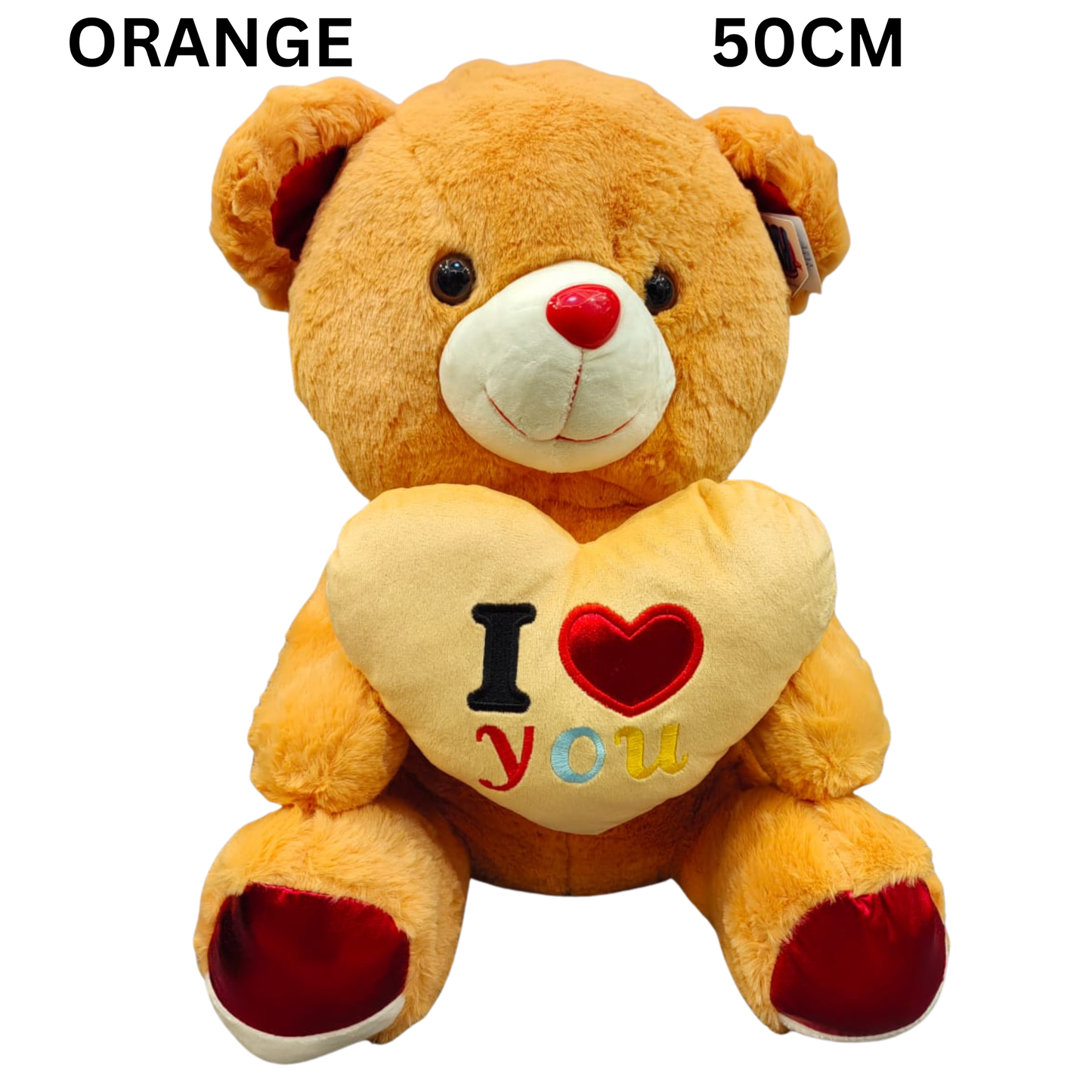 Sweet Confessions Teddy Bear glowing with orangey brown charm and 'I love you' message with a heart-shaped pillow.